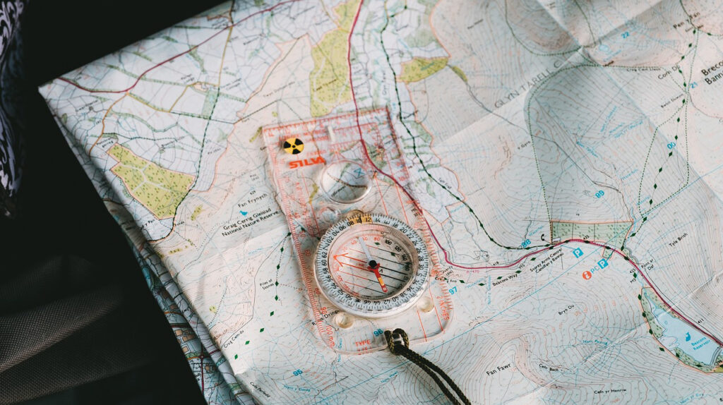 hiking navigation with compass, map and gps